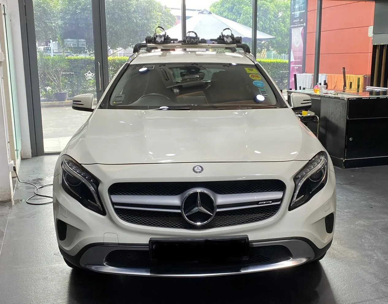 White Mercedes-Benz GLA crossover front view with roof rack at Infratint Singapore
