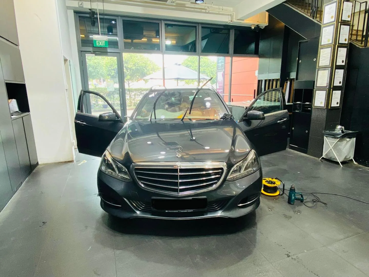 Grey Mercedes-Benz sedan having its windscreen tinted at Infratint Singapore