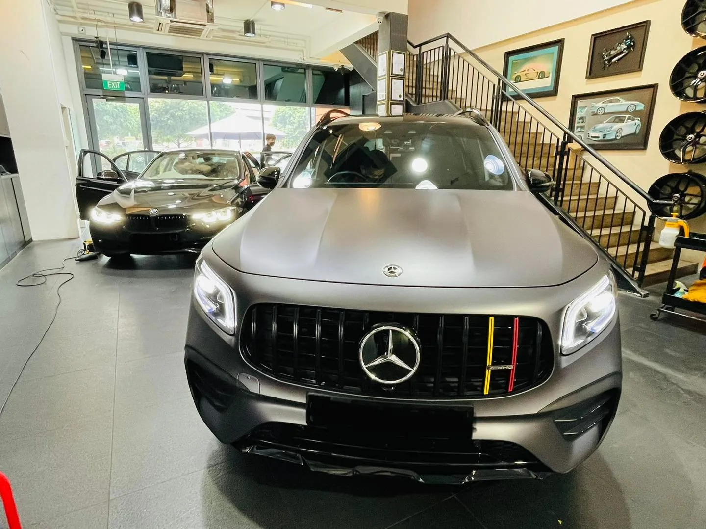 Satin grey Mercedes-Benz SUV and white sedan at Infratint Singapore for window tinting