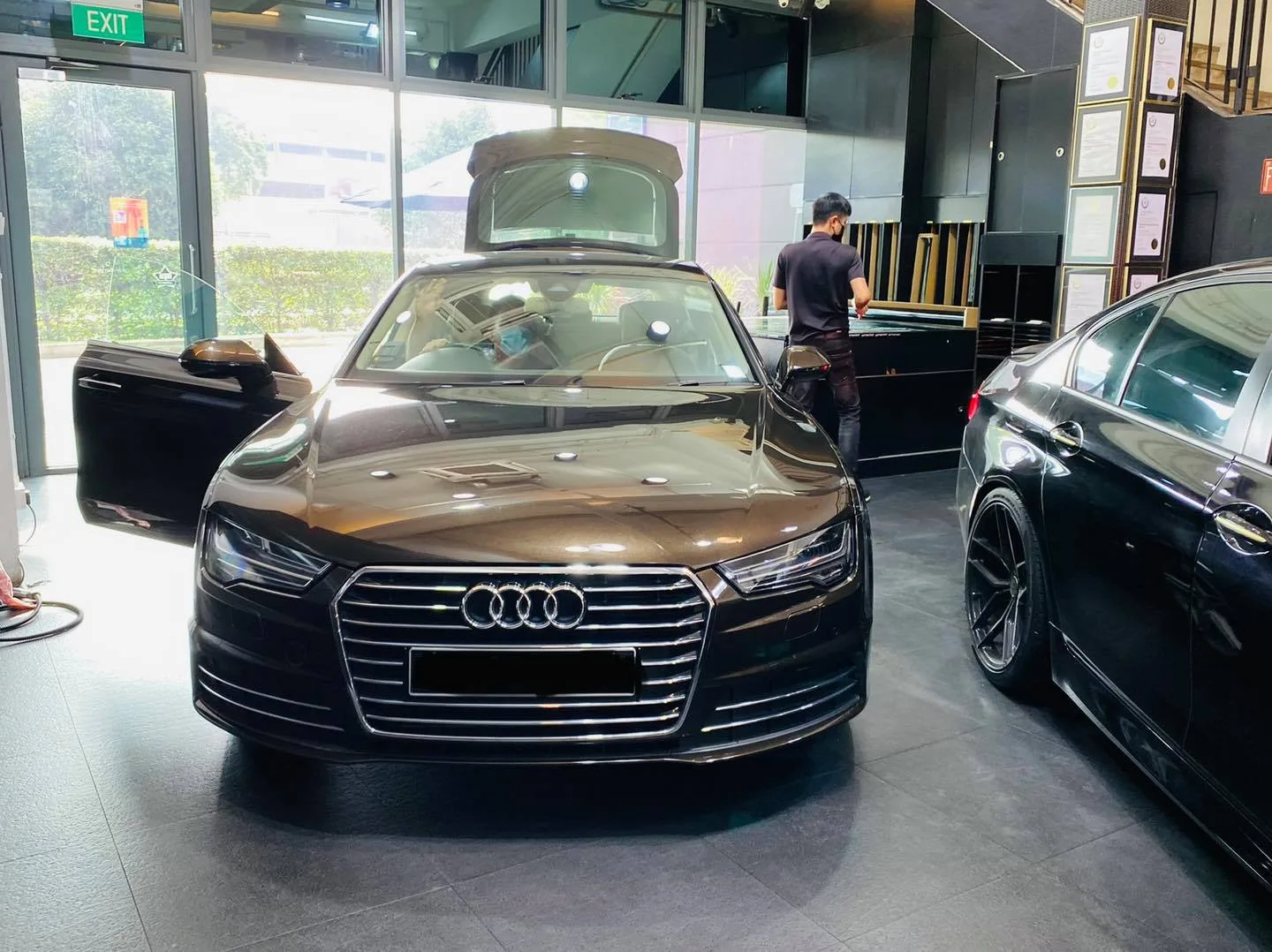 Brown Audi sedan during window film installation at Infratint Singapore