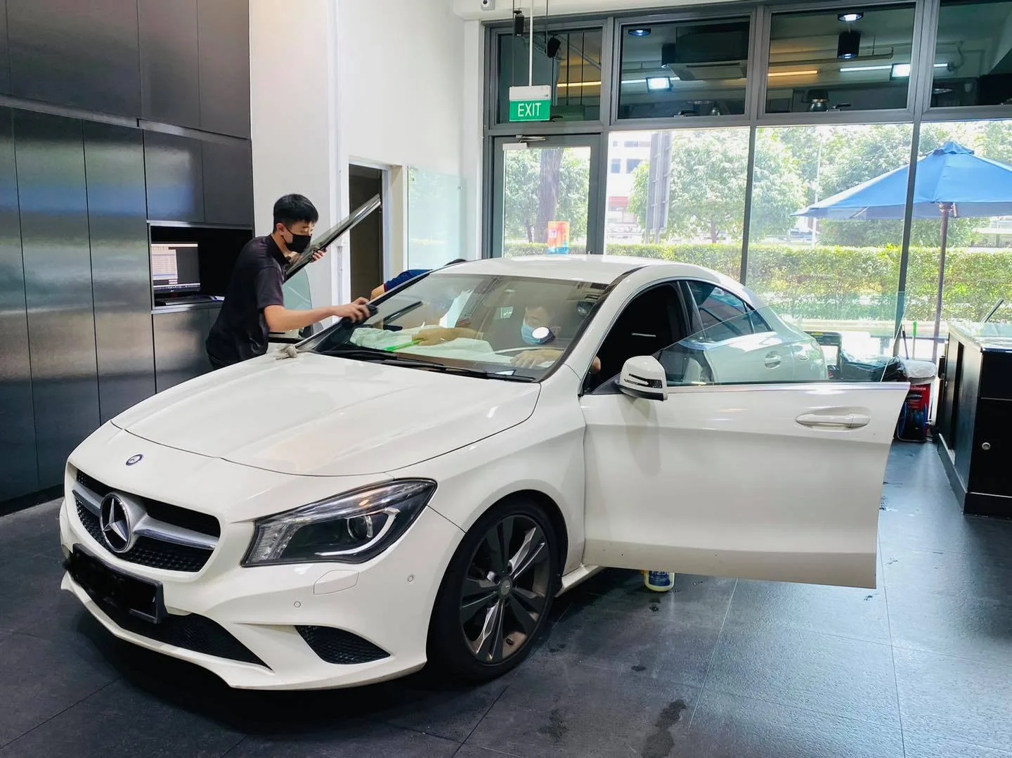 White Mercedes-Benz sedan having its windscreen tinted at Infratint Singapore