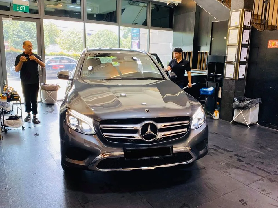 Grey Mercedes-Benz GLC SUV being prepared for window tinting at Infratint Singapore