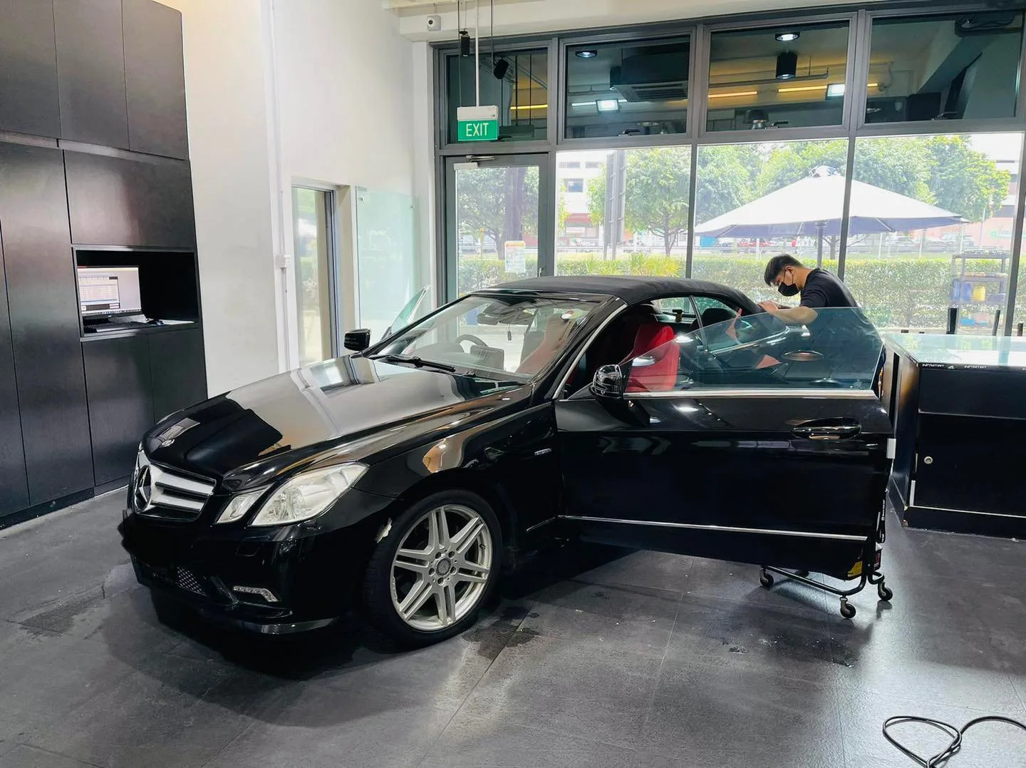 Black Mercedes-Benz E-Class coupe with AMG styling at Infratint Singapore
