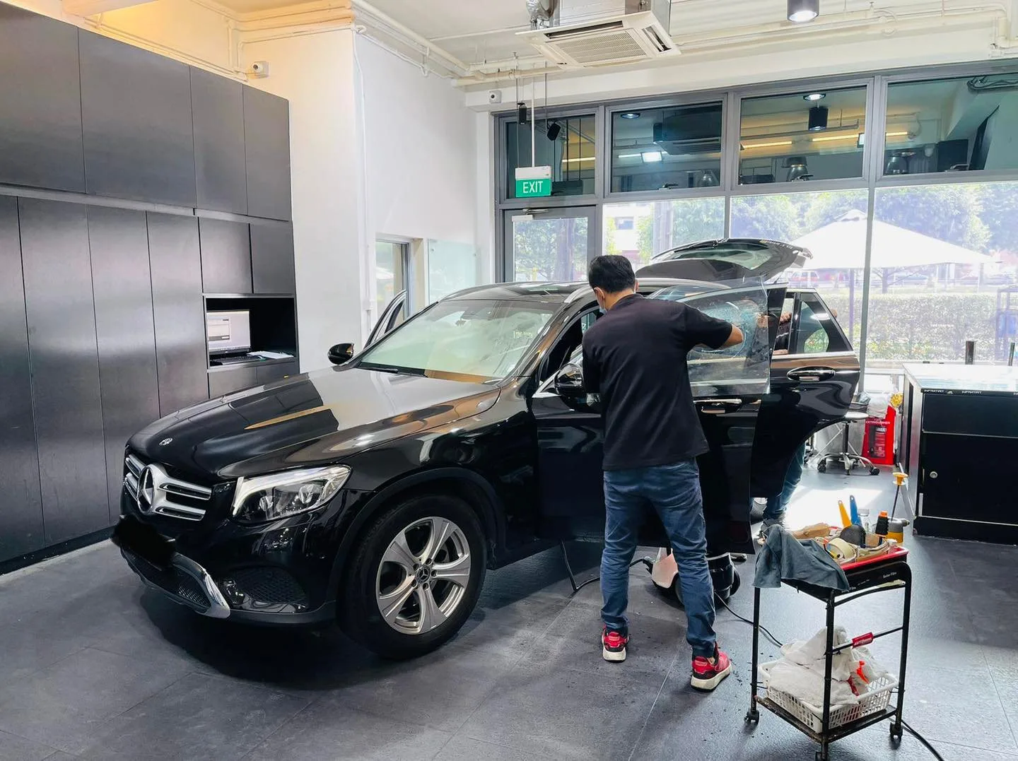 Black Mercedes-Benz GLC SUV with tailgate open during window tinting at Infratint Singapore