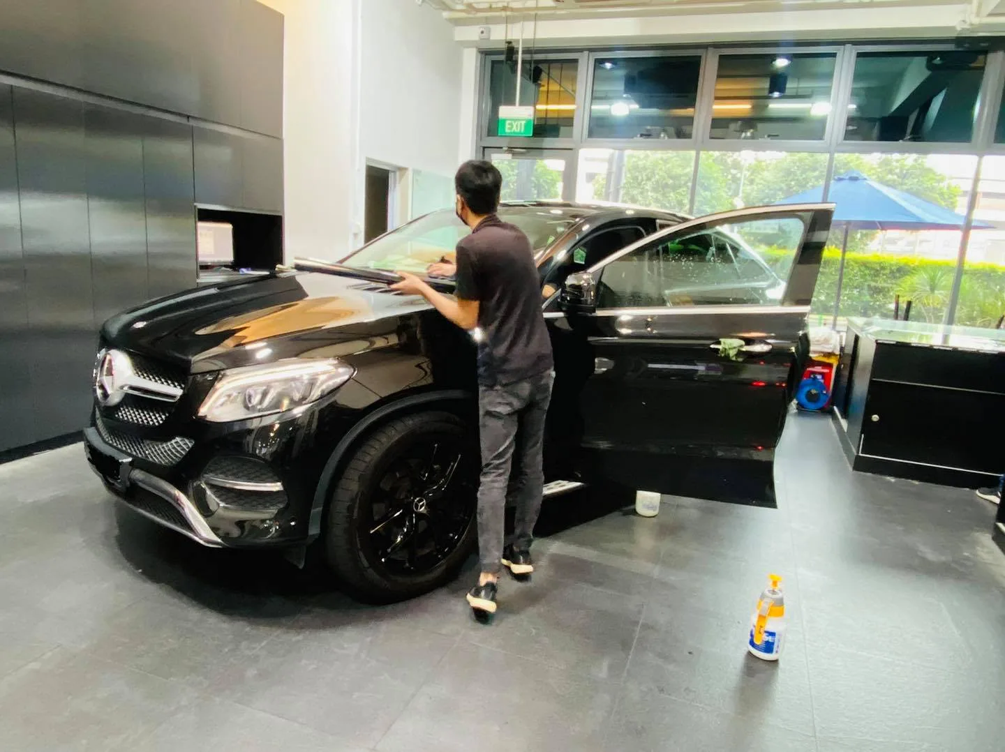 Black Mercedes-Benz GLE Coupe during window film installation at Infratint Singapore