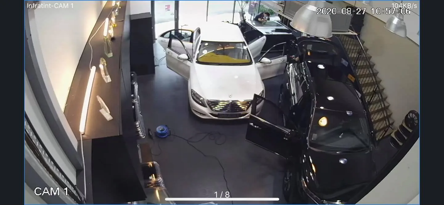 White Mercedes-Benz S-Class and a black sedan in the Infratint Singapore install bay seen on CCTV