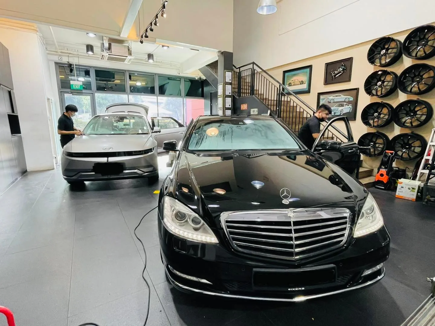 Black Mercedes-Benz sedan inside the Infratint Singapore showroom for window tinting
