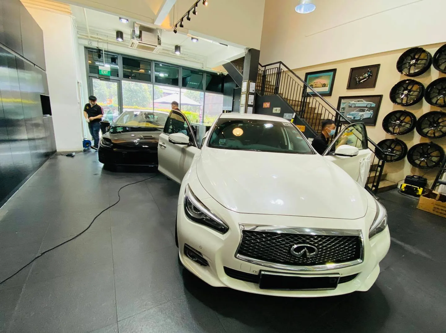 White Infiniti Q50 at Infratint Singapore for window film installation