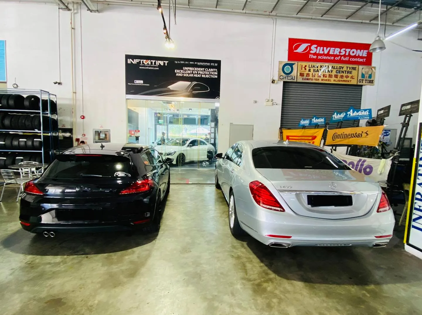 Silver Mercedes-Benz S-Class and black Porsche at Infratint Singapore window tinting workshop