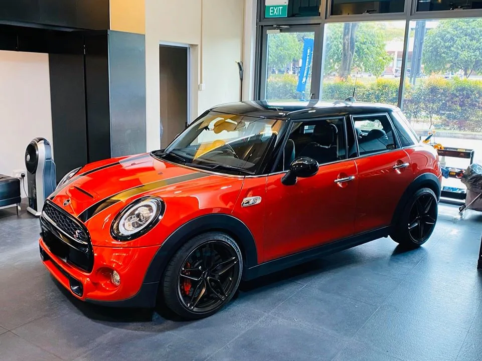 Orange Mini Cooper S with tinted windows parked at Infratint Singapore