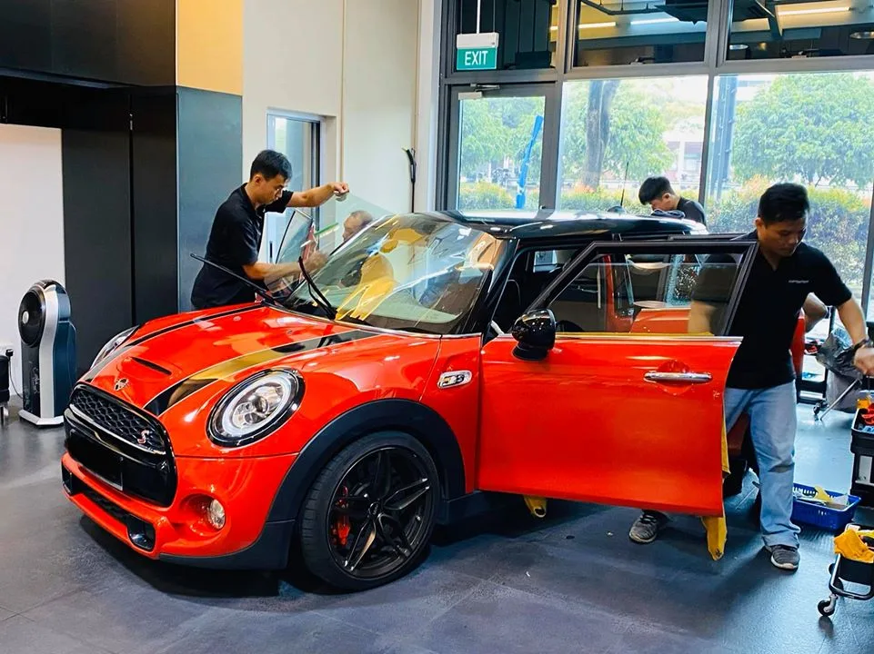 Orange Mini Cooper S having windshield film installed at Infratint Singapore