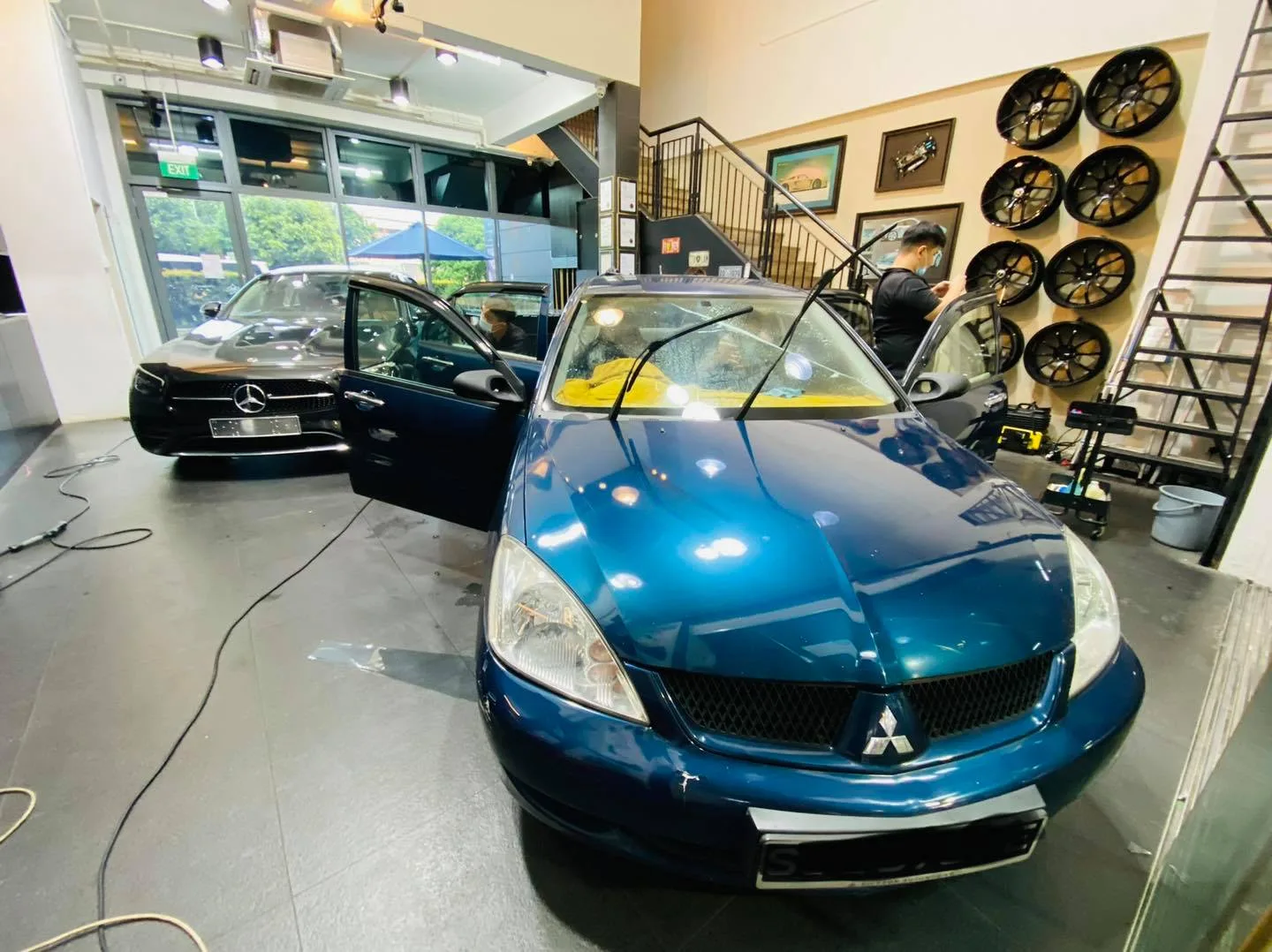 Blue Mitsubishi Lancer front three-quarter at Infratint Singapore