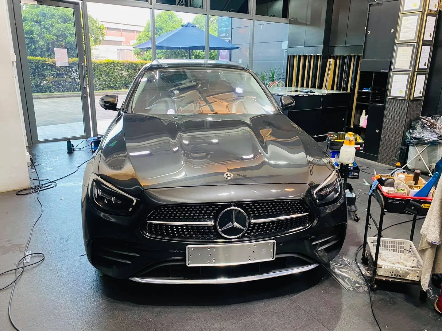 Dark grey Mercedes-Benz E-Class sedan front view at Infratint Singapore