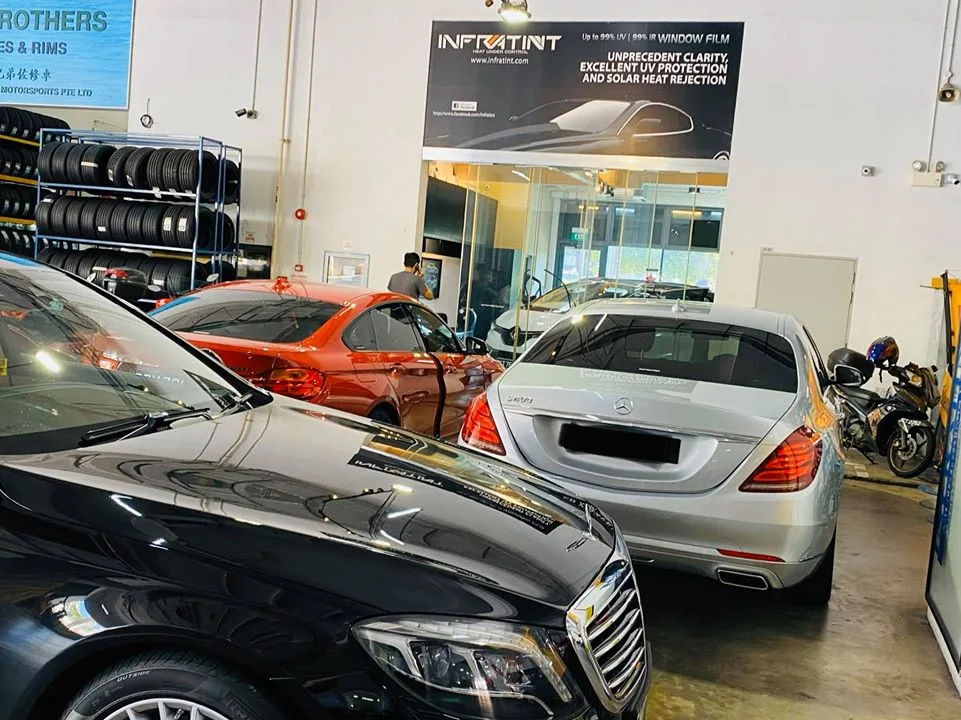 Black Mercedes-Benz, copper BMW and silver Mercedes-Benz S-Class at Infratint Singapore for window tinting