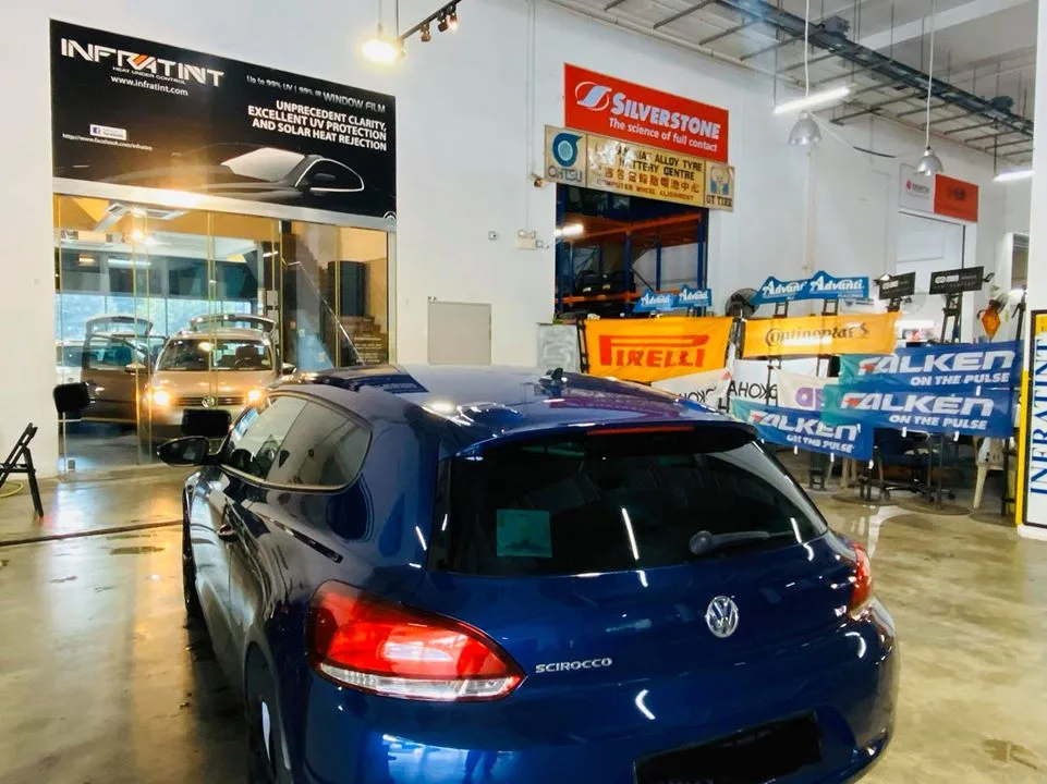 Blue Volkswagen Scirocco in the install bay at Infratint Singapore for window tinting