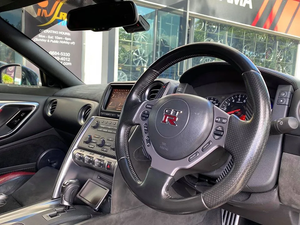 Nissan GT-R interior with GT-R steering wheel and dashboard at Infratint Singapore