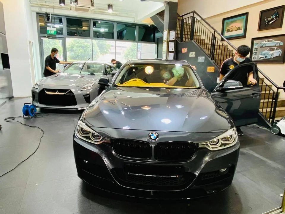 Grey BMW 3 Series and Nissan GT-R during window tinting at Infratint Singapore