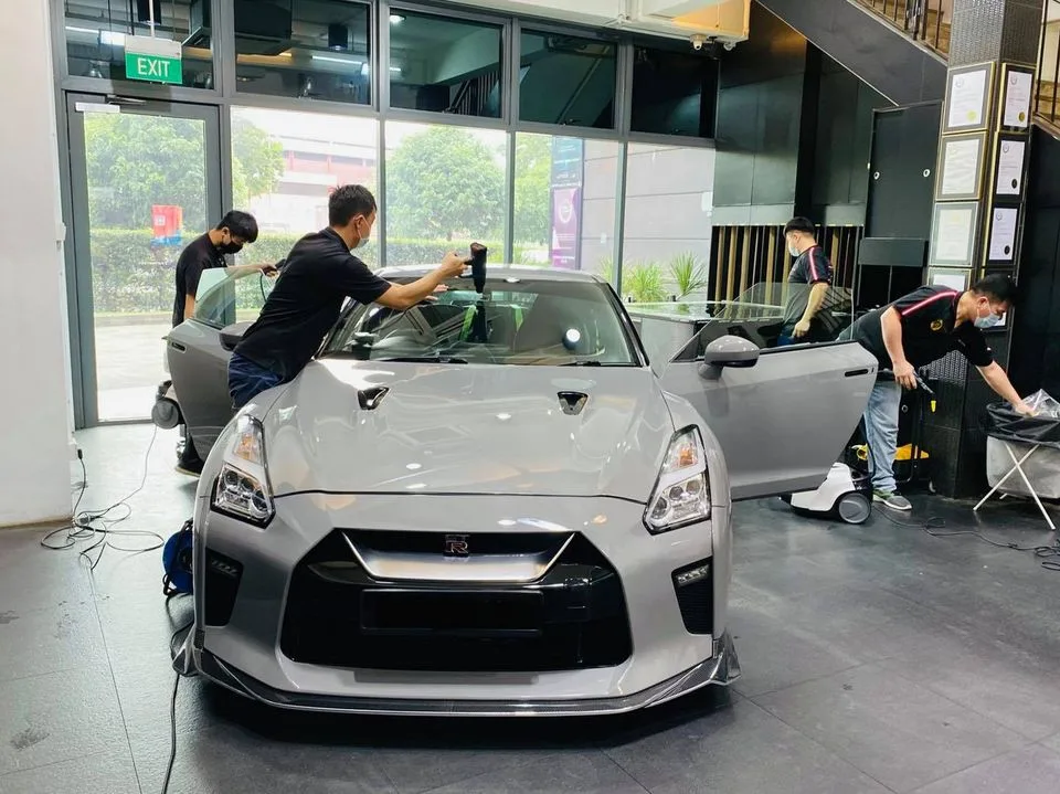Grey Nissan GT-R front view during window film fitting at Infratint Singapore