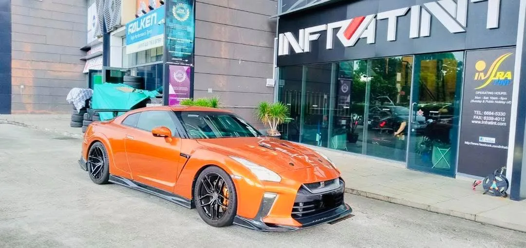 Orange Nissan GT-R front three-quarter view outside Infratint Singapore