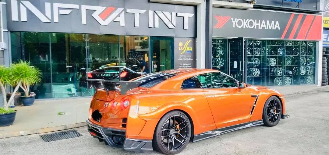 Orange Nissan GT-R rear three-quarter view at Infratint Singapore