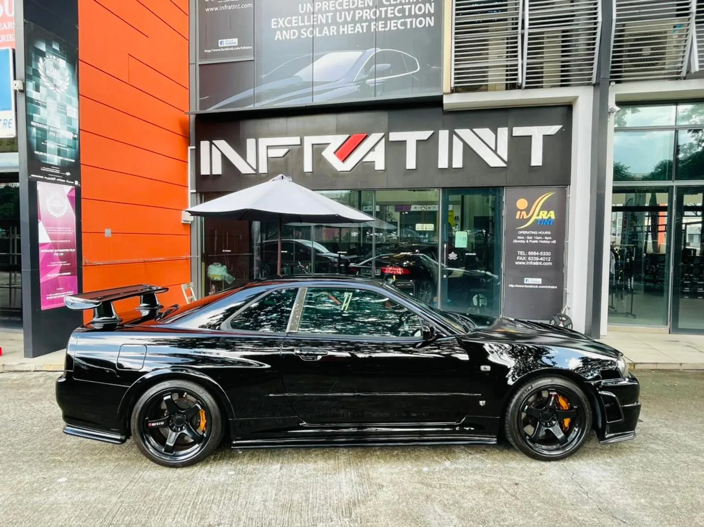Black Nissan GT-R R34 side profile outside Infratint Singapore