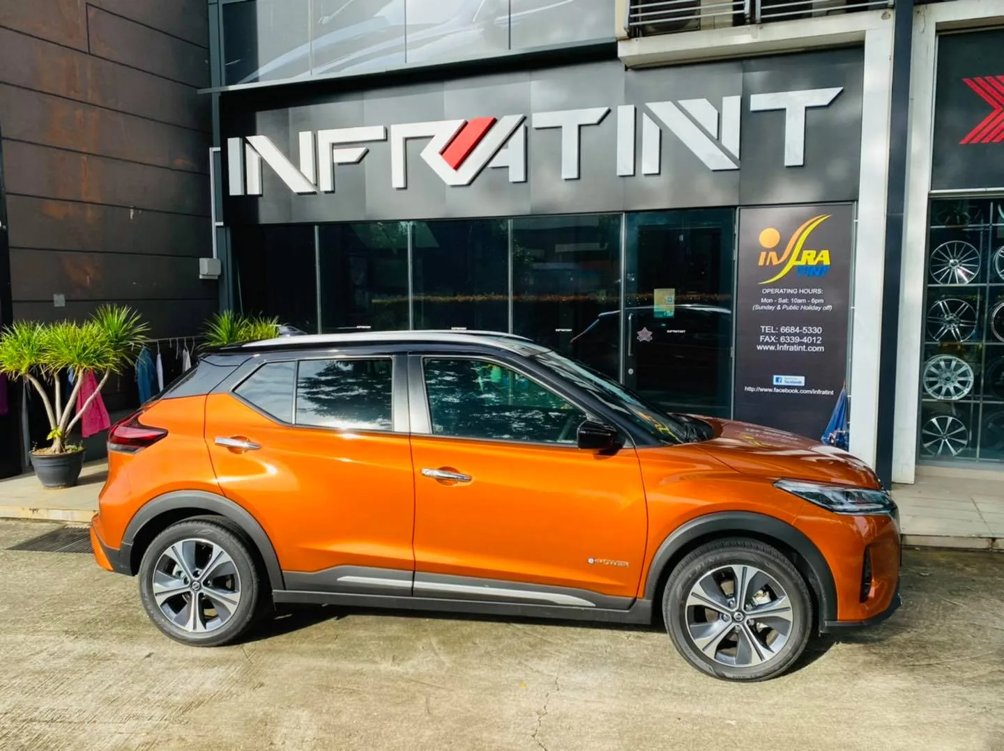 Orange Nissan Kicks side profile with fresh window tint at Infratint Singapore
