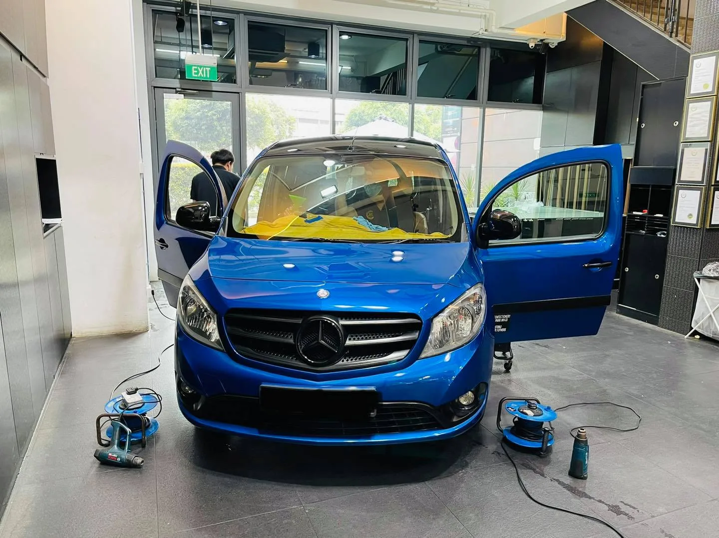 Blue Mercedes-Benz van with doors open at Infratint Singapore