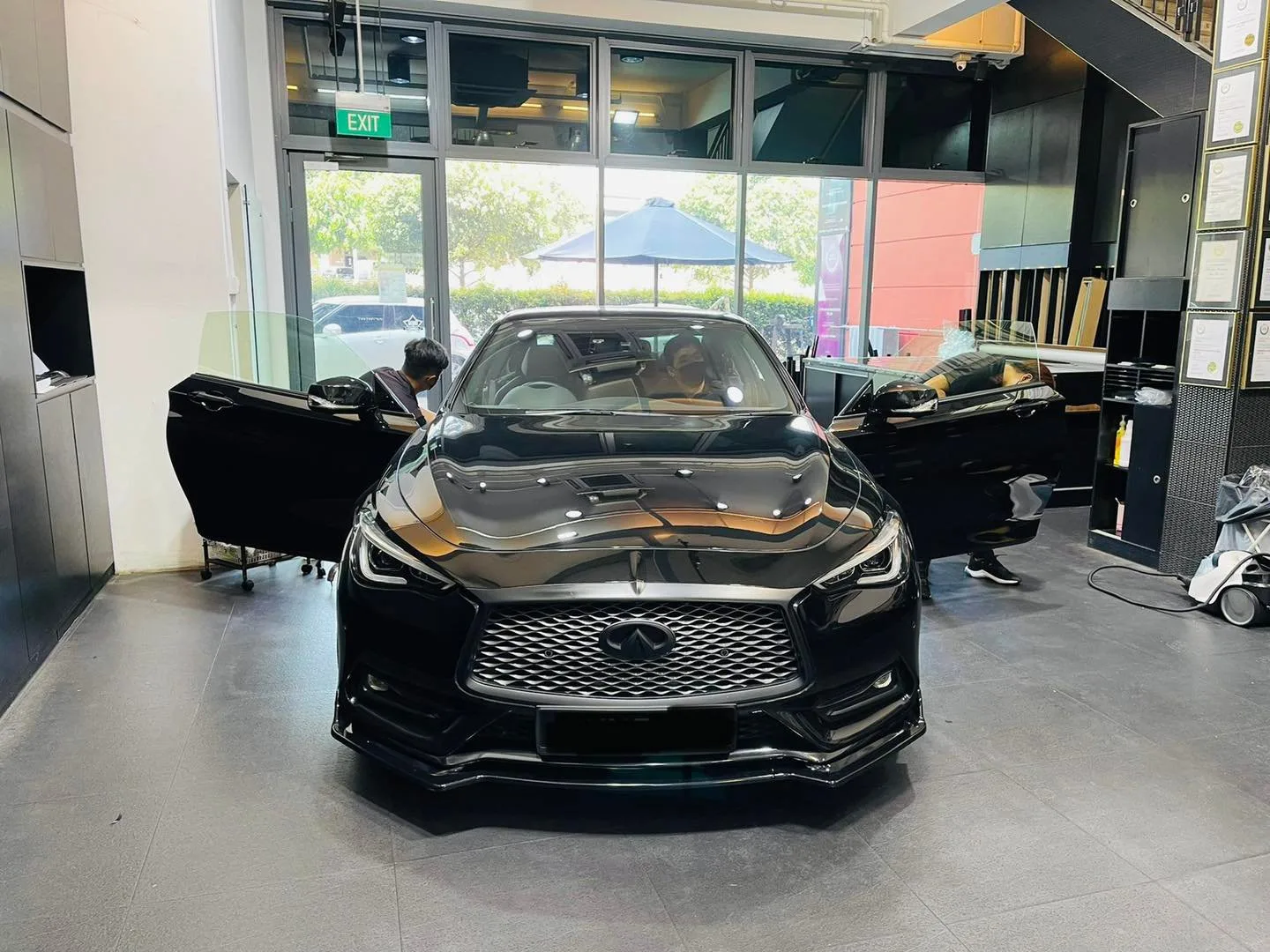 Black Infiniti Q60 coupe viewed head-on at Infratint Singapore for window tinting