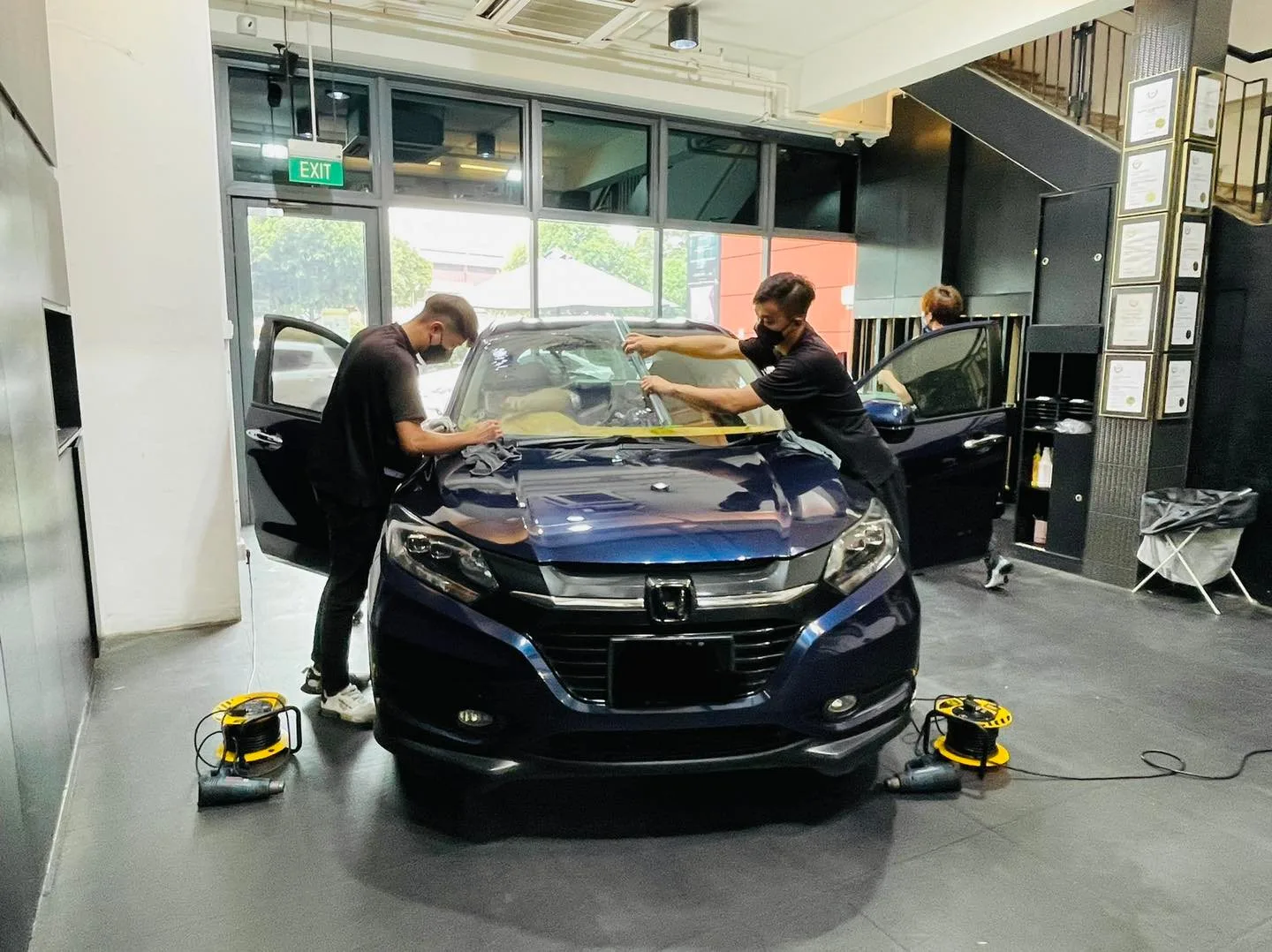 Dark blue Honda Vezel having windscreen film fitted at Infratint Singapore