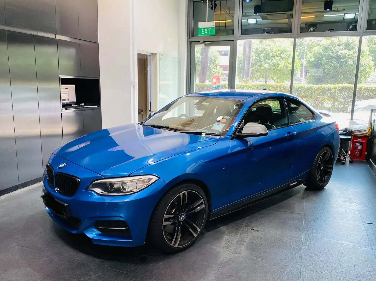 Blue BMW 2 Series coupe at Infratint Singapore for window tinting