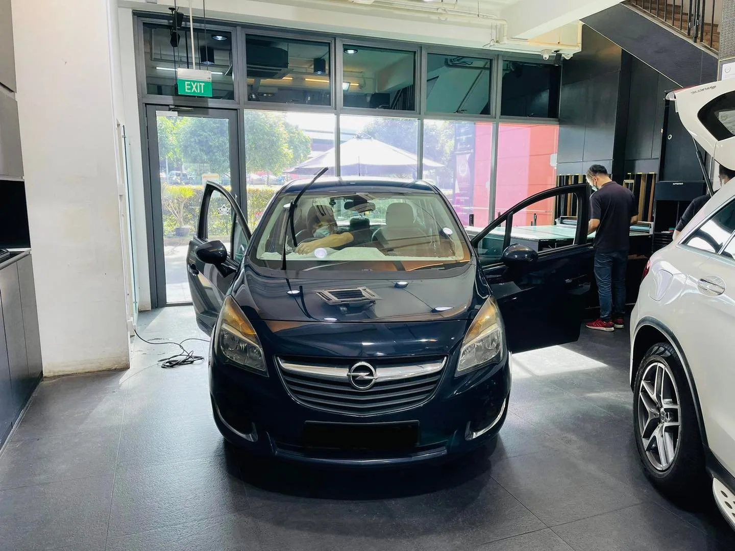 Dark blue Opel Meriva in for window tinting at Infratint Singapore