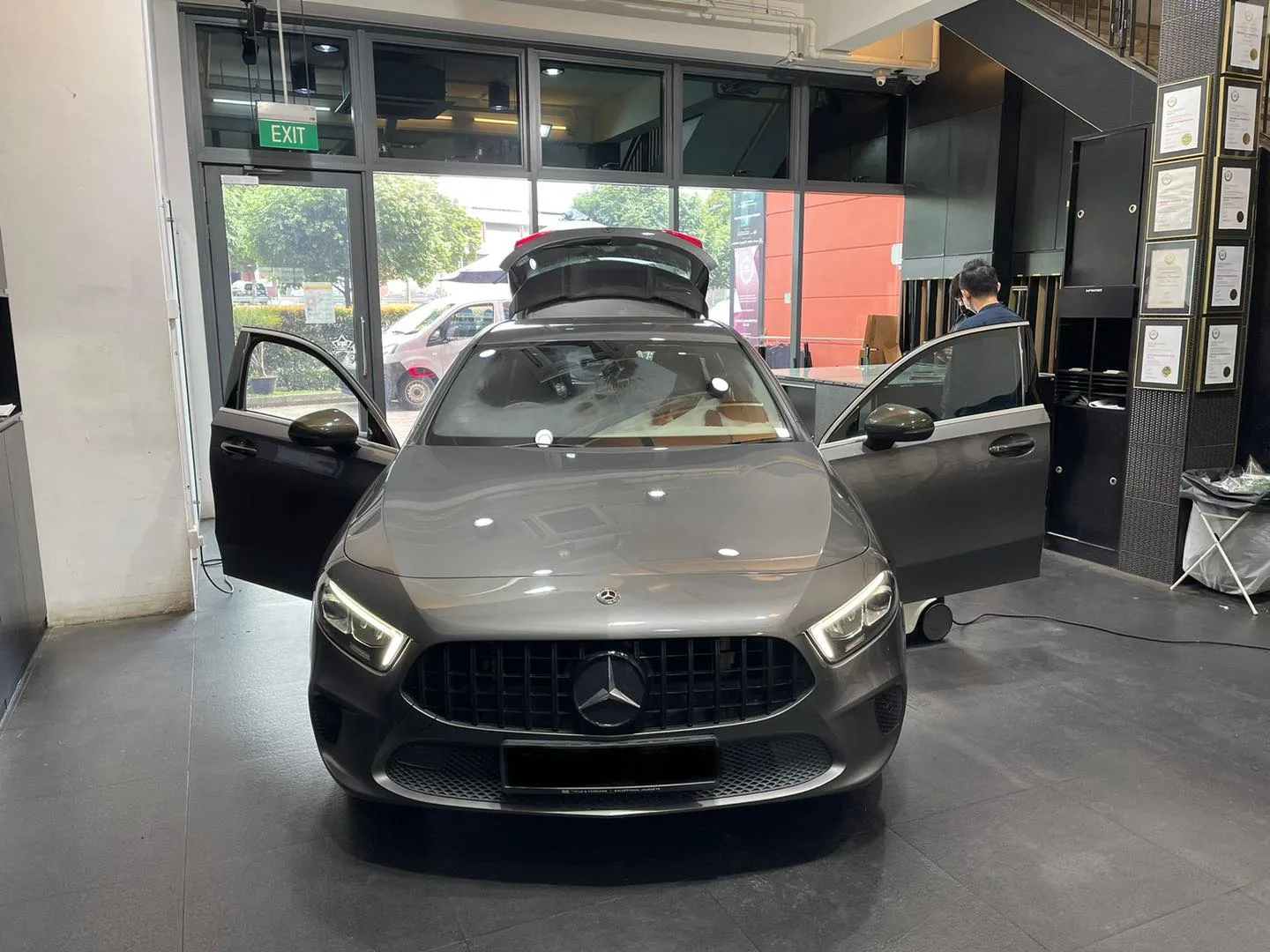 Grey Mercedes-Benz A-Class being prepped for window tinting at Infratint Singapore