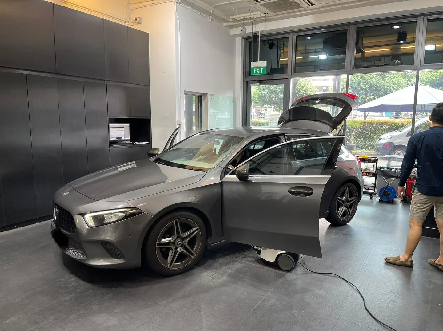 Grey Mercedes-Benz A-Class hatch during window film installation at Infratint Singapore