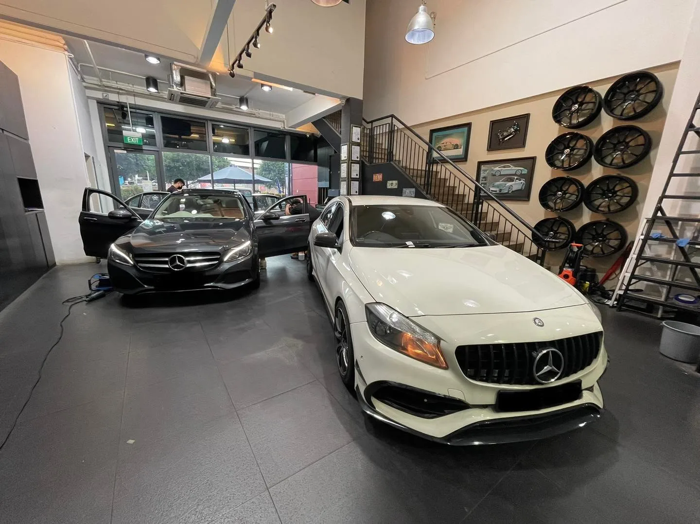 White Mercedes-Benz CLA and grey A-Class at Infratint Singapore window tinting showroom