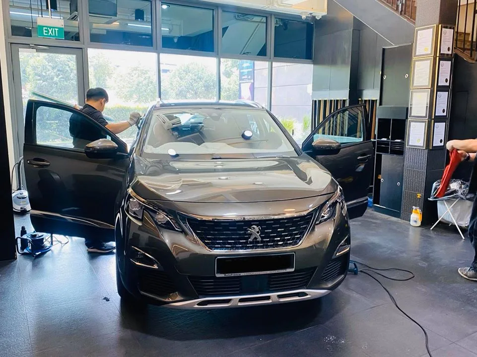 Grey Peugeot 3008 SUV having windscreen film fitted at Infratint Singapore