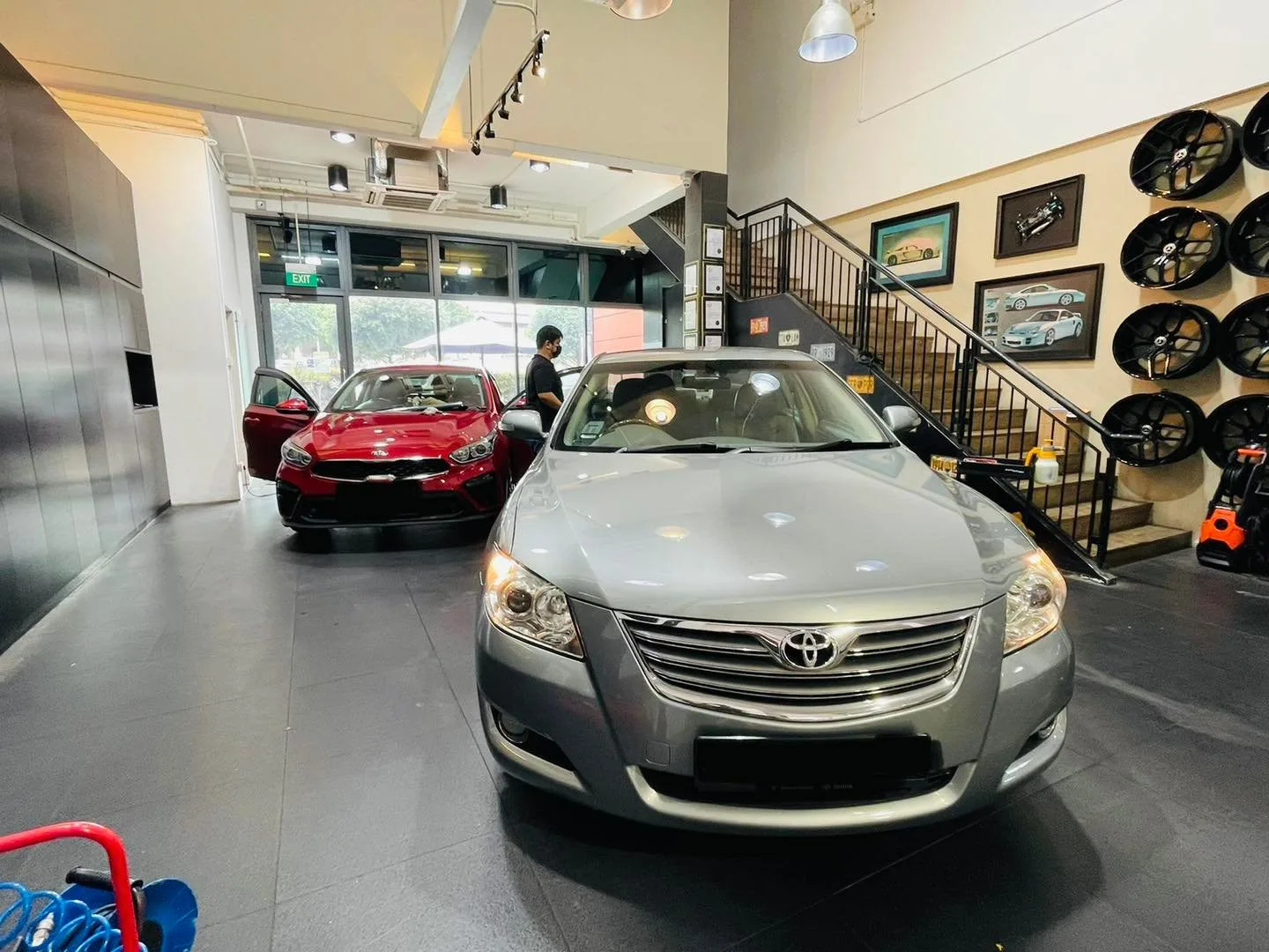 Grey and red Toyota sedans at Infratint Singapore for window tinting