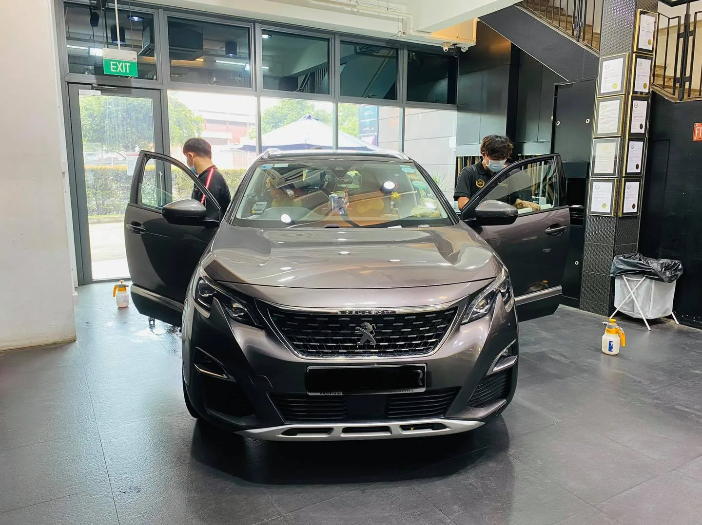Grey Peugeot 5008 SUV with doors open at Infratint Singapore for window film
