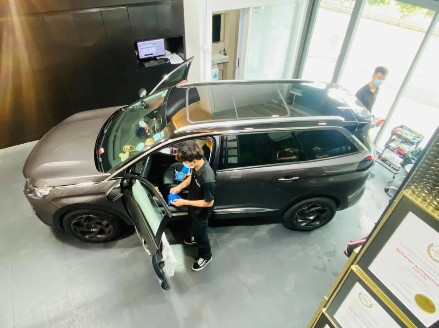 Overhead view of a grey Peugeot 5008 SUV being tinted at Infratint Singapore