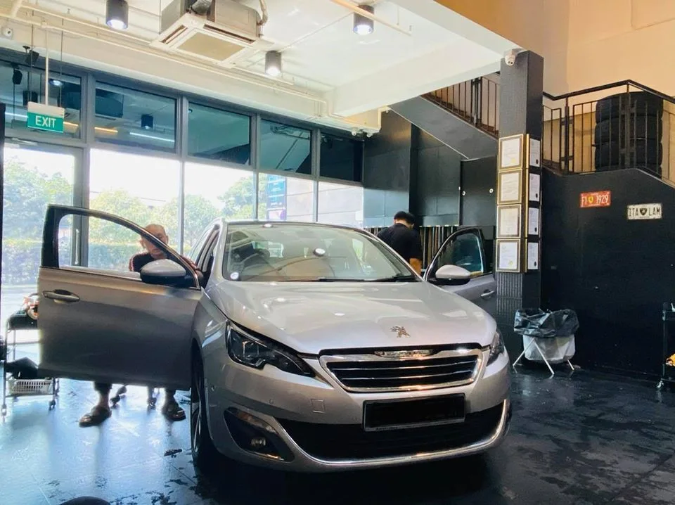 Silver Peugeot hatchback front three-quarter at Infratint Singapore for window tinting