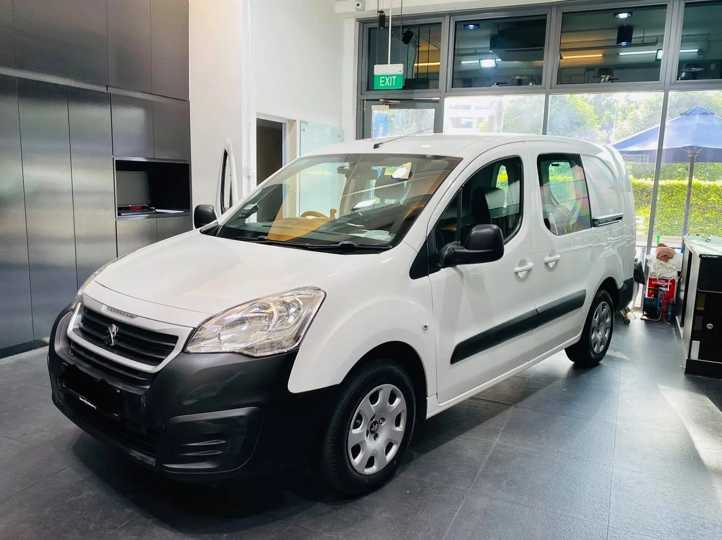 White Peugeot Partner van in three-quarter view at Infratint Singapore