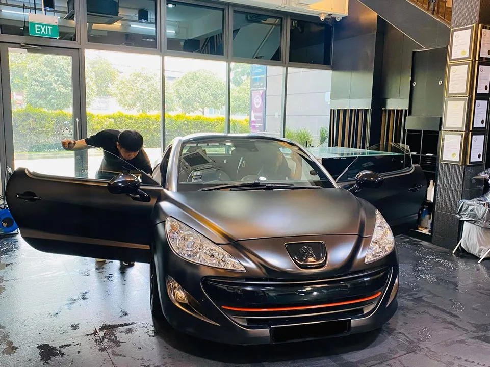 Matte black Peugeot RCZ being tinted at Infratint Singapore