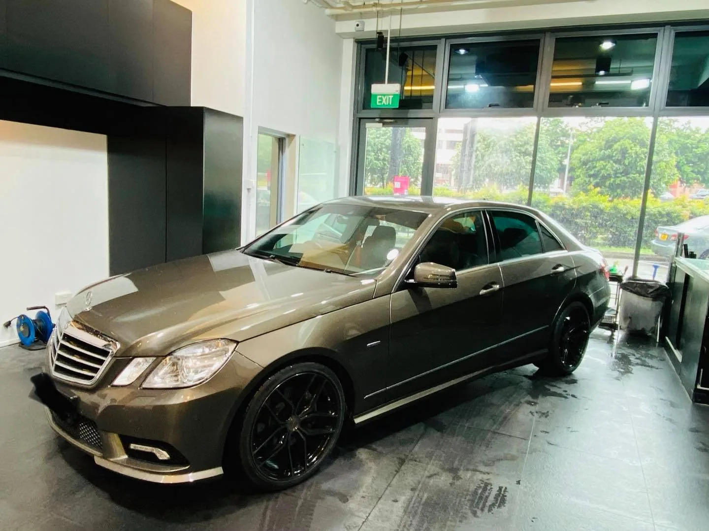 Bronze Mercedes-Benz E-Class sedan with black wheels at Infratint Singapore for a window film upgrade