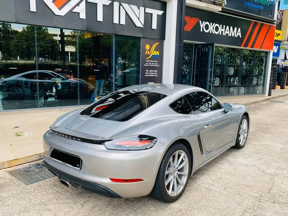 Silver Porsche 718 Cayman rear view after window tinting at Infratint Singapore