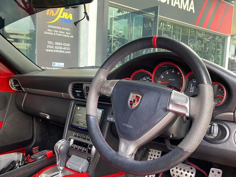 Porsche 911 steering wheel and dashboard interior at Infratint Singapore