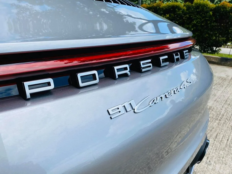 Close-up of Porsche 911 Carrera 4S rear badging at Infratint Singapore