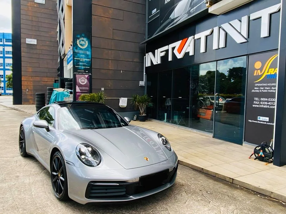 Silver Porsche 911 Carrera 4S parked outside Infratint Singapore