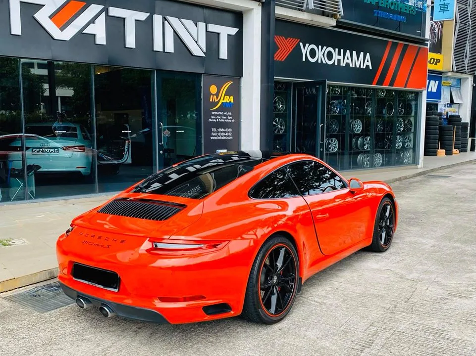 Orange Porsche 911 Carrera S rear three-quarter at Infratint Singapore
