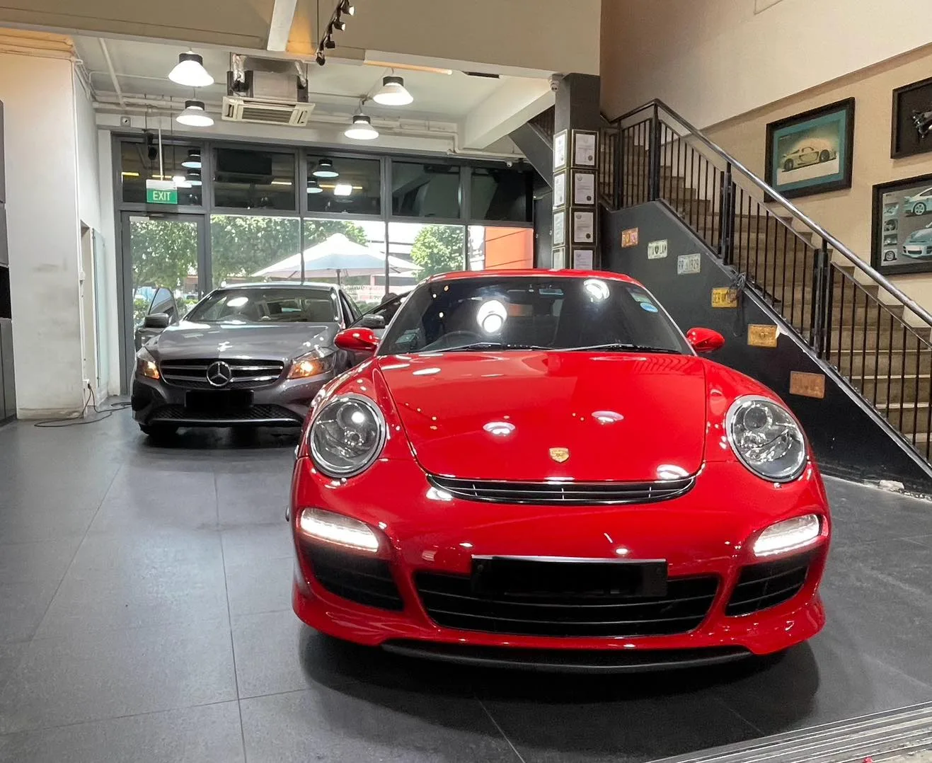 Red Porsche 911 front view inside the Infratint showroom