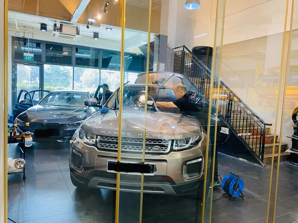 Brown Range Rover Evoque having its windscreen tinted at Infratint Singapore