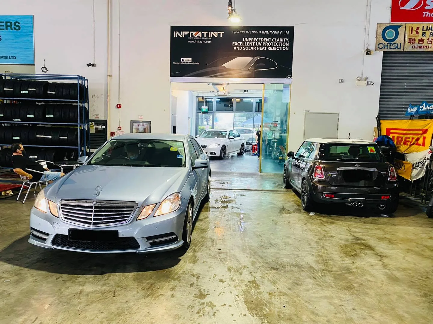 Silver Mercedes-Benz E-Class and black Mini Cooper at Infratint Singapore window tinting bay